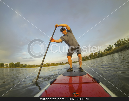 To use this stock image in your creative project, please select the size you need over to the right and click the "Add to Cart" button.
Your downloaded image will come with the Cutcaster watermark removed so don’t worry about the watermark you see on this page. paddling stand up board stock photo, mature male paddler enjoying workout on stand up paddleboard (SUP), calm lake in Colorado, summer by Marek Uliasz