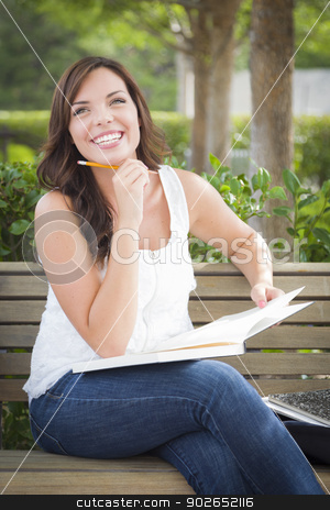To use this stock image in your creative project, please select the size you need over to the right and click the "Add to Cart" button.
Your downloaded image will come with the Cutcaster watermark removed so don’t worry about the watermark you see on this page. Young Adult Female Student on Bench Outdoors stock photo, Attractive Young Adult Female Student on Bench Outdoors with Books and Pencil. by Andy Dean