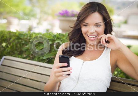 To use this stock image in your creative project, please select the size you need over to the right and click the "Add to Cart" button.
Your downloaded image will come with the Cutcaster watermark removed so don’t worry about the watermark you see on this page. Young Adult Female Texting on Cell Phone Outdoors stock photo, Attractive Smiling Young Adult Female Texting on Cell Phone Outdoors on a Bench. by Andy Dean