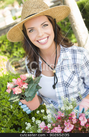 To use this stock image in your creative project, please select the size you need over to the right and click the "Add to Cart" button.
Your downloaded image will come with the Cutcaster watermark removed so don’t worry about the watermark you see on this page. Young Adult Woman Wearing Hat Gardening Outdoors stock photo, Attractive Happy Young Adult Woman Wearing Hat Gardening Outdoors. by Andy Dean