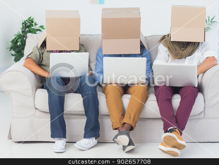To use this stock image in your creative project, please select the size you need over to the right and click the "Add to Cart" button.
Your downloaded image will come with the Cutcaster watermark removed so don’t worry about the watermark you see on this page. Designers working on laptops with boxes over their head stock photo, Designers working on laptops with boxes over their head sit in a sofa by Wavebreak Media