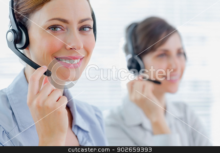To use this stock image in your creative project, please select the size you need over to the right and click the "Add to Cart" button.
Your downloaded image will come with the Cutcaster watermark removed so don’t worry about the watermark you see on this page. Smiling call centre agents with headsets at work stock photo, Smiling call centre agents with headsets at work in an office by Wavebreak Media