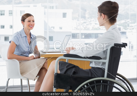 To use this stock image in your creative project, please select the size you need over to the right and click the "Add to Cart" button.
Your downloaded image will come with the Cutcaster watermark removed so don’t worry about the watermark you see on this page. Businesswoman speaking with disabled colleague stock photo, Businesswoman speaking with disabled colleague at desk in office by Wavebreak Media