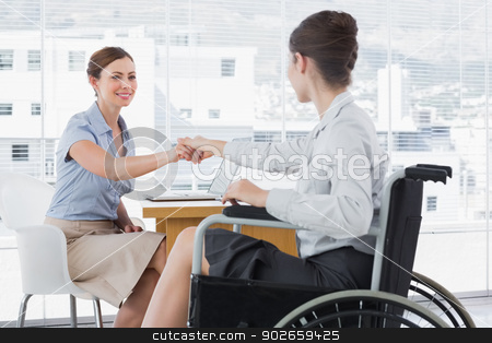 To use this stock image in your creative project, please select the size you need over to the right and click the "Add to Cart" button.
Your downloaded image will come with the Cutcaster watermark removed so don’t worry about the watermark you see on this page. Businesswoman shaking hands with disabled colleague stock photo, Businesswoman shaking hands with disabled colleague at desk in office by Wavebreak Media