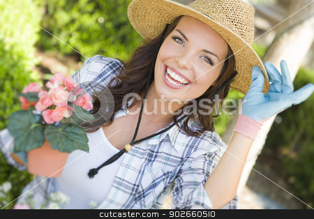 To use this stock image in your creative project, please select the size you need over to the right and click the "Add to Cart" button.
Your downloaded image will come with the Cutcaster watermark removed so don’t worry about the watermark you see on this page. Young Adult Woman Wearing Hat Gardening Outdoors stock photo, Attractive Happy Young Adult Woman Wearing Hat Gardening Outdoors. by Andy Dean