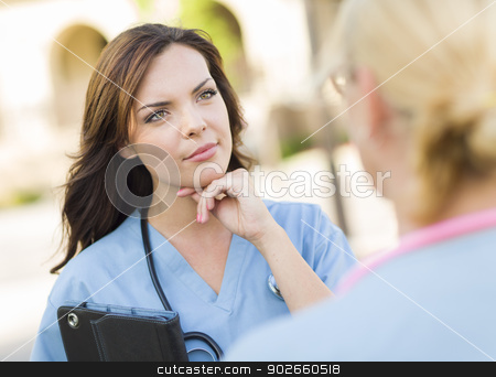 To use this stock image in your creative project, please select the size you need over to the right and click the "Add to Cart" button.
Your downloaded image will come with the Cutcaster watermark removed so don’t worry about the watermark you see on this page. Two Young Adult Female Doctors or Nurses Talking Outside stock photo, Two Young Adult Professional Female Doctors or Nurses Talking Outside. by Andy Dean