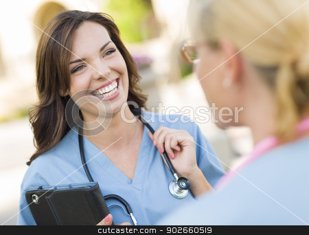 To use this stock image in your creative project, please select the size you need over to the right and click the "Add to Cart" button.
Your downloaded image will come with the Cutcaster watermark removed so don’t worry about the watermark you see on this page. Two Young Adult Female Doctors or Nurses Talking Outside stock photo, Two Young Adult Professional Female Doctors or Nurses Talking Outside. by Andy Dean