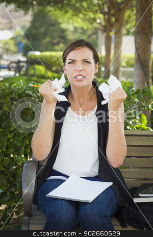 To use this stock image in your creative project, please select the size you need over to the right and click the "Add to Cart" button.
Your downloaded image will come with the Cutcaster watermark removed so don’t worry about the watermark you see on this page. Upset Young Woman with Pencil and Crumpled Paper in Hands stock photo, Frustrated and Upset Young Woman with Pencil and Crumpled Paper in Her Hands Sitting on Bench Outside. by Andy Dean