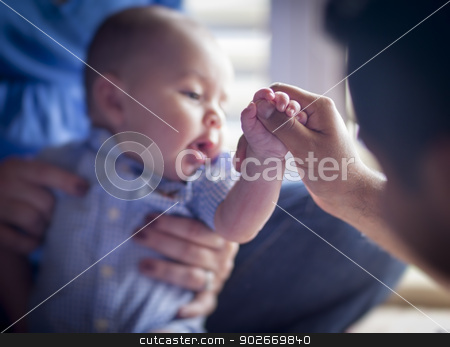 To use this stock image in your creative project, please select the size you need over to the right and click the "Add to Cart" button.
Your downloaded image will come with the Cutcaster watermark removed so don’t worry about the watermark you see on this page. Cute Mixed Race Infant Boy Holds Father's Thumb stock photo, Cute Mixed Race Infant Holds Father's Thumb as Mom Looks On - Focus is on the Hand of the Baby Boy. by Andy Dean