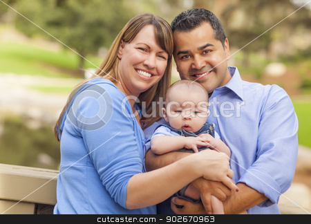 To use this stock image in your creative project, please select the size you need over to the right and click the "Add to Cart" button.
Your downloaded image will come with the Cutcaster watermark removed so don’t worry about the watermark you see on this page. Happy Mixed Race Family Posing for A Portrait Outside stock photo, Attractive Happy Mixed Race Young Family Posing for A Portrait Outside in the Park. by Andy Dean