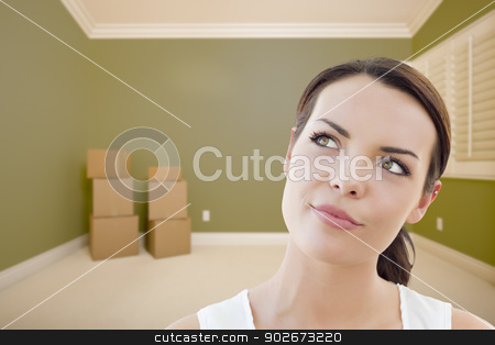 To use this stock image in your creative project, please select the size you need over to the right and click the "Add to Cart" button.
Your downloaded image will come with the Cutcaster watermark removed so don’t worry about the watermark you see on this page. Young Woman Daydreaming in Empty Room with Boxes stock photo, Attractive Daydreaming Young Woman in Empty Green Room with Boxes. by Andy Dean