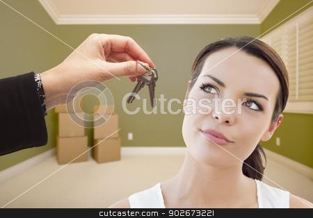 To use this stock image in your creative project, please select the size you need over to the right and click the "Add to Cart" button.
Your downloaded image will come with the Cutcaster watermark removed so don’t worry about the watermark you see on this page. Young Woman Being Handed Keys in Empty Room with Boxes stock photo, Attractive Young Woman Being Handed The Keys in Empty Green Room with Boxes. by Andy Dean