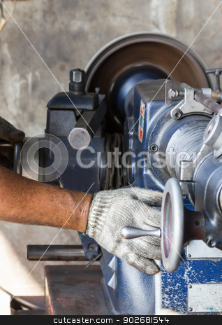 To use this stock image in your creative project, please select the size you need over to the right and click the "Add to Cart" button.
Your downloaded image will come with the Cutcaster watermark removed so don’t worry about the watermark you see on this page. Old lathe in workshop stock photo, Old lathe is ready to work in the workshop by stoonn