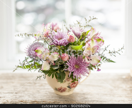 To use this stock image in your creative project, please select the size you need over to the right and click the "Add to Cart" button.
Your downloaded image will come with the Cutcaster watermark removed so don’t worry about the watermark you see on this page. Flower arrangement stock photo, Bouquet of colorful flowers arranged in small vase by Elena Elisseeva