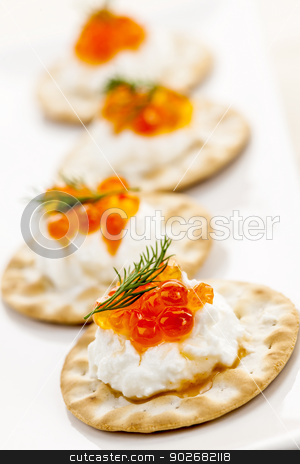 To use this stock image in your creative project, please select the size you need over to the right and click the "Add to Cart" button.
Your downloaded image will come with the Cutcaster watermark removed so don’t worry about the watermark you see on this page. Caviar appetizers stock photo, Closeup of caviar and cream cheese appetizer on crackers by Elena Elisseeva