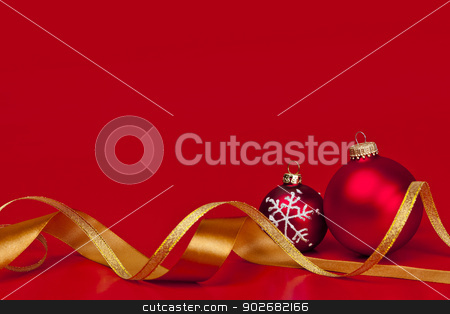To use this stock image in your creative project, please select the size you need over to the right and click the "Add to Cart" button.
Your downloaded image will come with the Cutcaster watermark removed so don’t worry about the watermark you see on this page. Red Christmas background with ornaments stock photo, Red Christmas background with ornaments and gold ribbon by Elena Elisseeva