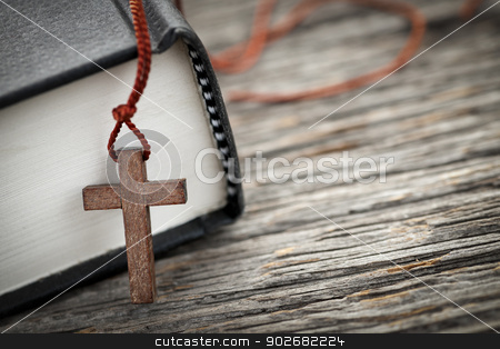 To use this stock image in your creative project, please select the size you need over to the right and click the "Add to Cart" button.
Your downloaded image will come with the Cutcaster watermark removed so don’t worry about the watermark you see on this page. Cross and Bible stock photo, Closeup of wooden Christian cross necklace next to holy Bible by Elena Elisseeva