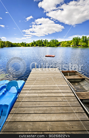 To use this stock image in your creative project, please select the size you need over to the right and click the "Add to Cart" button.
Your downloaded image will come with the Cutcaster watermark removed so don’t worry about the watermark you see on this page. Dock on lake in summer cottage country stock photo, Wooden dock on beautiful summer lake in Ontario Canada by Elena Elisseeva