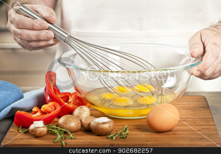 To use this stock image in your creative project, please select the size you need over to the right and click the "Add to Cart" button.
Your downloaded image will come with the Cutcaster watermark removed so don’t worry about the watermark you see on this page. Whisking eggs in bowl stock photo, Closeup on man's hands whisking eggs in bowl for cooking omelet with vegetables by Elena Elisseeva