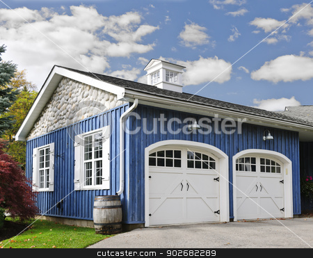 To use this stock image in your creative project, please select the size you need over to the right and click the "Add to Cart" button.
Your downloaded image will come with the Cutcaster watermark removed so don’t worry about the watermark you see on this page. Two car garage stock photo, Double car garage with white doors and blue exterior by Elena Elisseeva