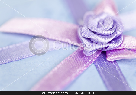 To use this stock image in your creative project, please select the size you need over to the right and click the "Add to Cart" button.
Your downloaded image will come with the Cutcaster watermark removed so don’t worry about the watermark you see on this page. Gift ribbon on box stock photo, Closeup of pink gift ribbon and bow on present by Elena Elisseeva