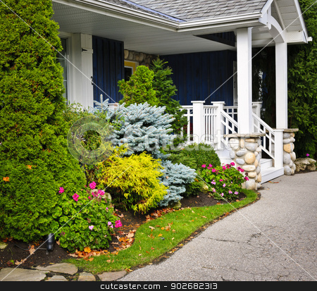 To use this stock image in your creative project, please select the size you need over to the right and click the "Add to Cart" button.
Your downloaded image will come with the Cutcaster watermark removed so don’t worry about the watermark you see on this page. Garden and home entrance stock photo, Front entrance of house with garden and porch by Elena Elisseeva