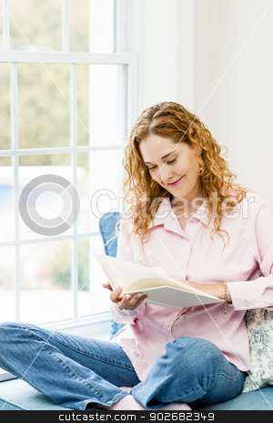 To use this stock image in your creative project, please select the size you need over to the right and click the "Add to Cart" button.
Your downloaded image will come with the Cutcaster watermark removed so don’t worry about the watermark you see on this page. Woman reading book by window stock photo, Smiling caucasian woman reading book by window at home by Elena Elisseeva
