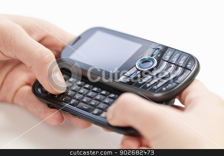 To use this stock image in your creative project, please select the size you need over to the right and click the "Add to Cart" button.
Your downloaded image will come with the Cutcaster watermark removed so don’t worry about the watermark you see on this page. Hands texting on phone stock photo, Female hands texting on slide-out keyboard of cellphone closeup by Elena Elisseeva