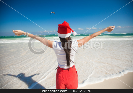 To use this stock image in your creative project, please select the size you need over to the right and click the "Add to Cart" button.
Your downloaded image will come with the Cutcaster watermark removed so don’t worry about the watermark you see on this page. Back view of beautiful girl in santa hat walking like a bird on white beach stock photo, Back view of beautiful girl in santa hat walking like a bird on white beach by Dmitry Travnikov