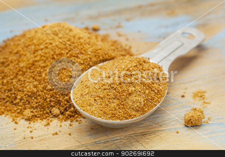 To use this stock image in your creative project, please select the size you need over to the right and click the "Add to Cart" button.
Your downloaded image will come with the Cutcaster watermark removed so don’t worry about the watermark you see on this page. coconut palm sugar stock photo, unrefiined coconut palm sugar - measuring tablespoon and pile on wood surface by Marek Uliasz