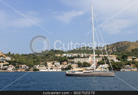 To use this stock image in your creative project, please select the size you need over to the right and click the "Add to Cart" button.
Your downloaded image will come with the Cutcaster watermark removed so don’t worry about the watermark you see on this page. Alcudia coastline stock photo, Scenic view of Alcudia coastline with yacht moored in foreground, Majorca, Spain. by Martin Crowdy