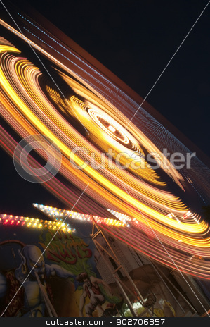 To use this stock image in your creative project, please select the size you need over to the right and click the "Add to Cart" button.
Your downloaded image will come with the Cutcaster watermark removed so don’t worry about the watermark you see on this page. Amusement Park stock photo, blurs and color effects created by rides at the amusement park by Vlad Podkhlebnik