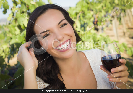 To use this stock image in your creative project, please select the size you need over to the right and click the "Add to Cart" button.
Your downloaded image will come with the Cutcaster watermark removed so don’t worry about the watermark you see on this page. Young Adult Woman Enjoying A Glass of Wine in Vineyard stock photo, Pretty Mixed Race Young Adult Woman Enjoying A Glass of Wine in the Vineyard. by Andy Dean