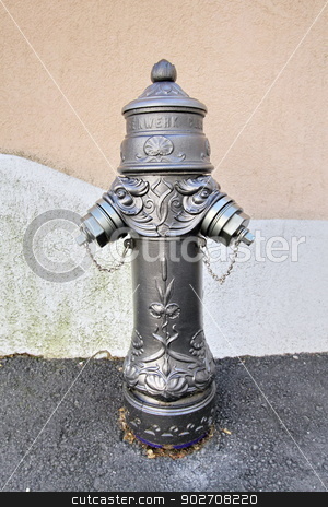 fire hydrant stock photo, old gray fire hydrant in front of a