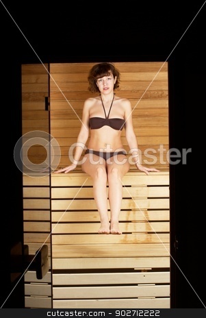 To use this stock image in your creative project, please select the size you need over to the right and click the "Add to Cart" button.
Your downloaded image will come with the Cutcaster watermark removed so don’t worry about the watermark you see on this page. Woman in sauna stock photo, Young woman sitting on wooden bench in sauna cabin by Aikon