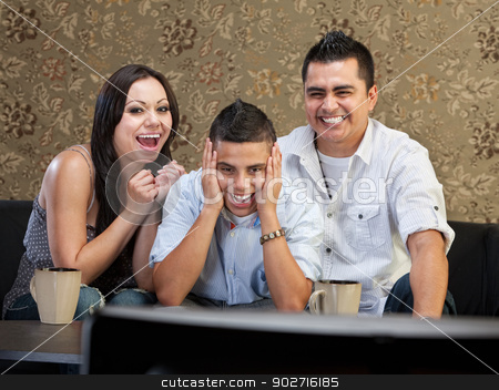To use this stock image in your creative project, please select the size you need over to the right and click the "Add to Cart" button.
Your downloaded image will come with the Cutcaster watermark removed so don’t worry about the watermark you see on this page. Family Laughing at TV stock photo, Happy family of three laughing at a television by Scott Griessel