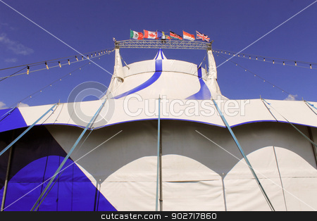To use this stock image in your creative project, please select the size you need over to the right and click the "Add to Cart" button.
Your downloaded image will come with the Cutcaster watermark removed so don’t worry about the watermark you see on this page. Blue and white circus tent stock photo, Blue and white circus tent with different country flags, blue sky and cloudscape background. by Martin Crowdy
