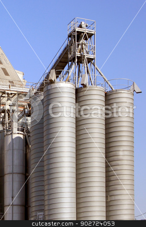 To use this stock image in your creative project, please select the size you need over to the right and click the "Add to Cart" button.
Your downloaded image will come with the Cutcaster watermark removed so don’t worry about the watermark you see on this page. cereal industry stock photo, factory for the processing of cereals for food for cattle by Cochonneau