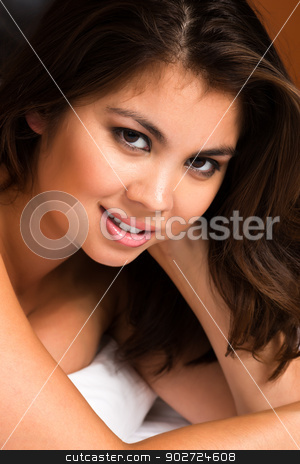 To use this stock image in your creative project, please select the size you need over to the right and click the "Add to Cart" button.
Your downloaded image will come with the Cutcaster watermark removed so don’t worry about the watermark you see on this page. Eurasian stock photo, Beautiful young Eurasian woman lying in bed by Harris Shiffman