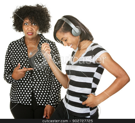 To use this stock image in your creative project, please select the size you need over to the right and click the "Add to Cart" button.
Your downloaded image will come with the Cutcaster watermark removed so don’t worry about the watermark you see on this page. Woman Next to Dancing Teen stock photo, Bothered woman behind dancing teen with headphones by Scott Griessel