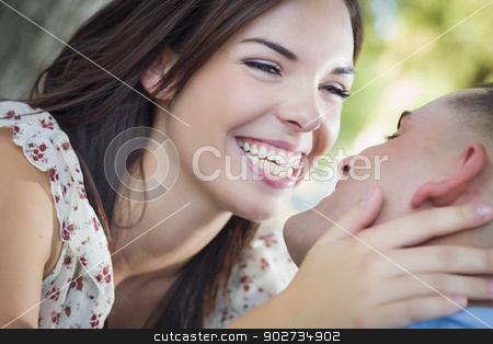 To use this stock image in your creative project, please select the size you need over to the right and click the "Add to Cart" button.
Your downloaded image will come with the Cutcaster watermark removed so don’t worry about the watermark you see on this page. Mixed Race Romantic Couple Kissing in the Park stock photo, Happy Mixed Race Romantic Couple Kissing in the Park. by Andy Dean