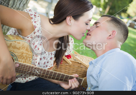To use this stock image in your creative project, please select the size you need over to the right and click the "Add to Cart" button.
Your downloaded image will come with the Cutcaster watermark removed so don’t worry about the watermark you see on this page. Mixed Race Couple with Guitar Kissing in the Park stock photo, Affectionate Mixed Race Couple with Guitar Kissing in the Park. by Andy Dean