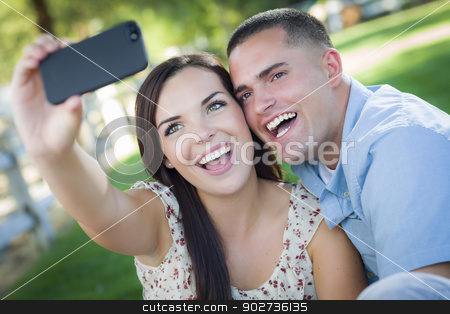 To use this stock image in your creative project, please select the size you need over to the right and click the "Add to Cart" button.
Your downloaded image will come with the Cutcaster watermark removed so don’t worry about the watermark you see on this page. Mixed Race Couple Taking Self Portrait in Park stock photo, Happy Mixed Race Couple Taking Self Portrait with A Smart Phone in the Park. by Andy Dean