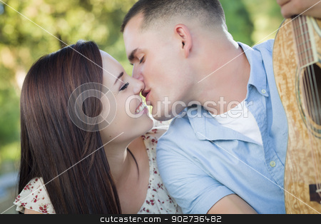 To use this stock image in your creative project, please select the size you need over to the right and click the "Add to Cart" button.
Your downloaded image will come with the Cutcaster watermark removed so don’t worry about the watermark you see on this page. Mixed Race Couple Portrait with Guitar in Park stock photo, Affectionate Mixed Race Couple Portrait with Guitar in the Park. by Andy Dean