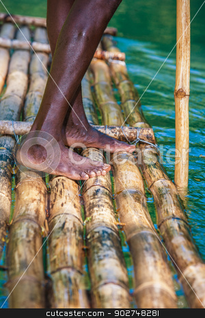 To use this stock image in your creative project, please select the size you need over to the right and click the "Add to Cart" button.
Your downloaded image will come with the Cutcaster watermark removed so don’t worry about the watermark you see on this page. Captain's On Bamboo Boat stock photo, Feet of River Boat and Captain on Martha Brae River in Jamaica by Scott Griessel
