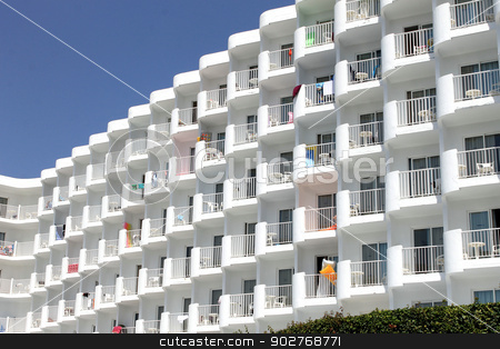 To use this stock image in your creative project, please select the size you need over to the right and click the "Add to Cart" button.
Your downloaded image will come with the Cutcaster watermark removed so don’t worry about the watermark you see on this page. Generic white tourist hotel stock photo, Generic white tourist hotel with towels hanging from balconies. by Martin Crowdy