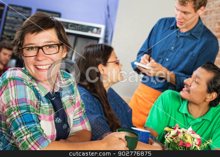 To use this stock image in your creative project, please select the size you need over to the right and click the "Add to Cart" button.
Your downloaded image will come with the Cutcaster watermark removed so don’t worry about the watermark you see on this page. Happy Woman in Cafe stock photo, Happy young woman with eyeglasses in cafe with friends by Scott Griessel