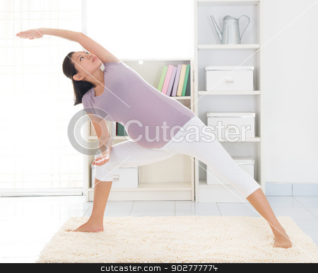 To use this stock image in your creative project, please select the size you need over to the right and click the "Add to Cart" button.
Your downloaded image will come with the Cutcaster watermark removed so don’t worry about the watermark you see on this page. Maternal yoga at home stock photo, Prenatal health concept. Full length healthy 8 months pregnant calm Asian woman meditating or doing yoga exercise at home. Relaxation yoga side stretching pose. by szefei