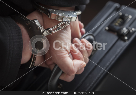 To use this stock image in your creative project, please select the size you need over to the right and click the "Add to Cart" button.
Your downloaded image will come with the Cutcaster watermark removed so don’t worry about the watermark you see on this page. Woman In Handcuffs Carrying Briefcase stock photo, Woman Wearing Handcuffs Carrying Briefcase In Dramatic Lighting. by Andy Dean