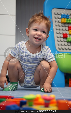 To use this stock image in your creative project, please select the size you need over to the right and click the "Add to Cart" button.
Your downloaded image will come with the Cutcaster watermark removed so don’t worry about the watermark you see on this page. A happy baby boy on a floor stock photo, A happy baby boy on a floor in children's room by vladacanon1